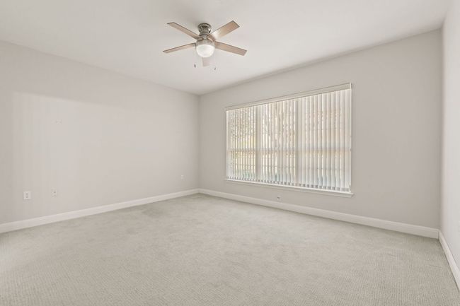Carpeted spare room with baseboards and ceiling fan | Image 18