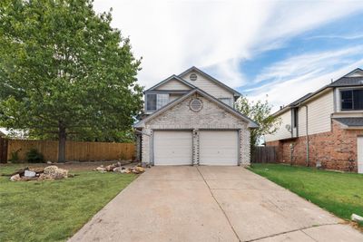 View of front of property with a front yard and a garage | Image 3