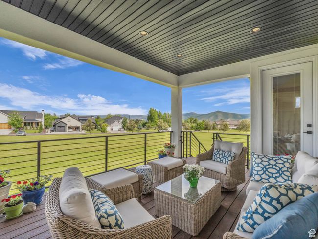 Wooden deck featuring outdoor lounge area, a mountain view, and a yard | Image 29