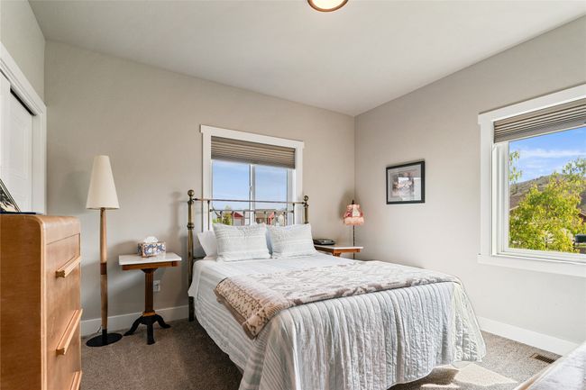 Bedroom with carpet floors, multiple windows, baseboards, and a closet | Image 24