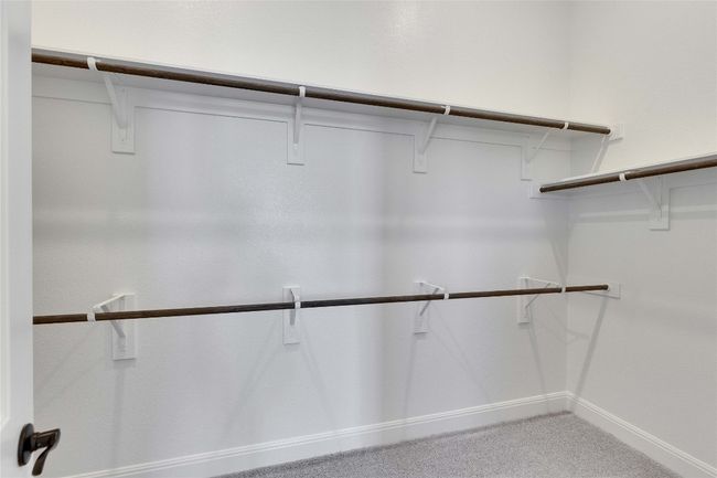 Spacious closet featuring carpet flooring | Image 6