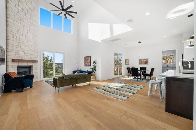Designed for elegance and functionality, this home boasts a seamlessly integrated open floor plan connecting the living room | Image 11