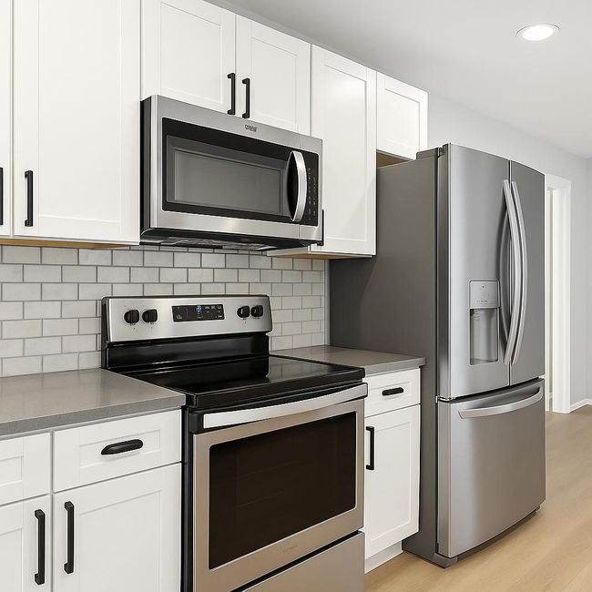 Kitchen featuring stainless steel appliances, light wood-style floors, white cabinetry, and recessed lighting | Image 10