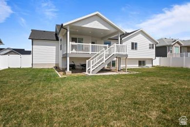 Back of property featuring a yard, a fenced backyard, and stairway | Image 34