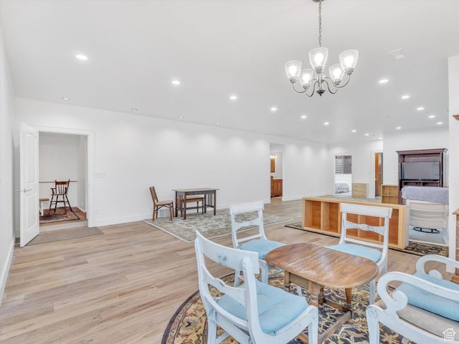 Dining space with recessed lighting, light wood-type flooring, and an inviting chandelier | Image 29