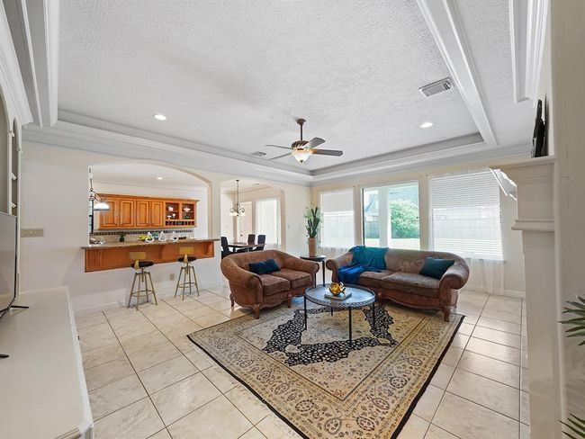 Cozy living room bathed in natural light. | Image 30