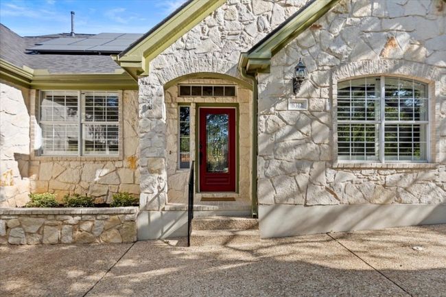 This ranch-style home showcases native limestone on all sides, adding to its timeless charm. | Image 7