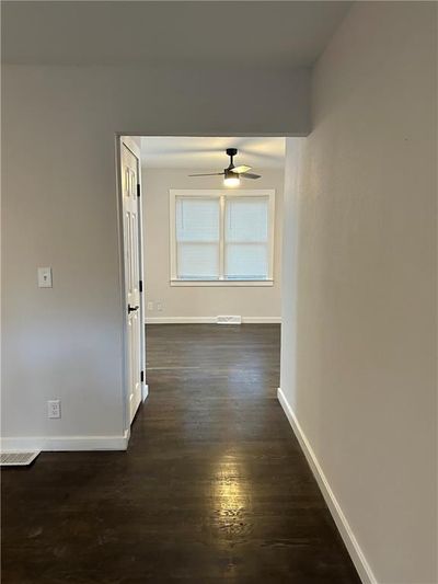 Corridor with dark wood-type flooring | Image 2