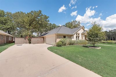 Ranch-style house featuring a double garage | Image 3