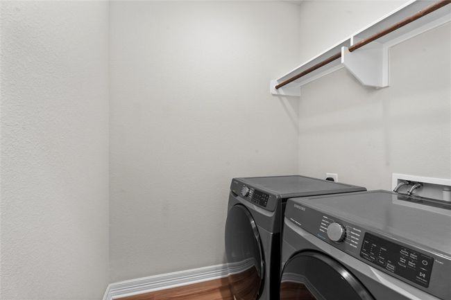 Laundry area featuring separate washer and dryer | Image 28