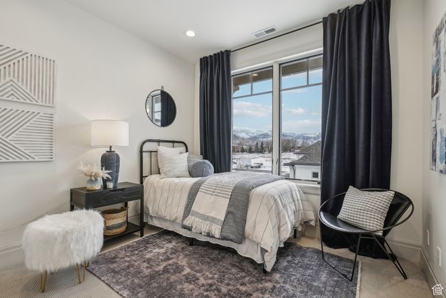 Carpeted bedroom featuring visible vents, a mountain view, and baseboards | Image 30
