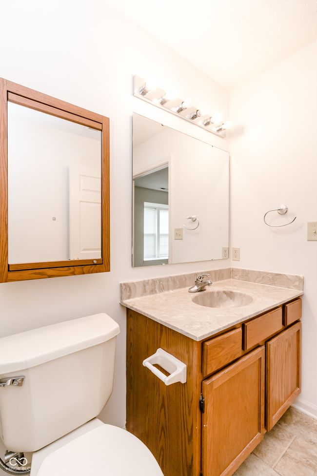 bathroom featuring toilet and vanity | Image 17