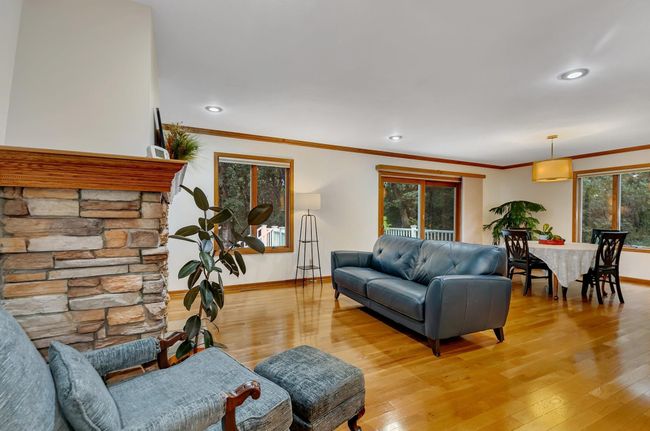 large living room with hard wood floors | Image 4