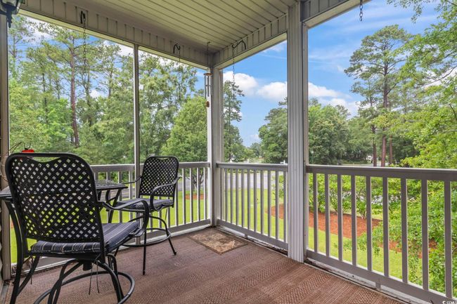 Sunroom with view of wooded area | Image 30