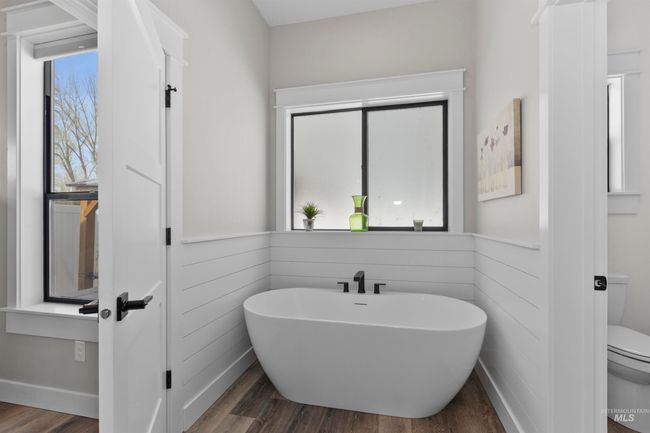 Bathroom with a soaking tub and wood finished floors | Image 29