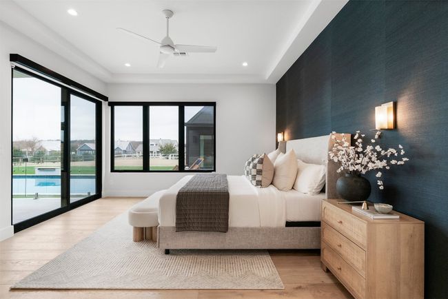 The primary suite is a secluded retreat, offering a tranquil escape with serene views of the backyard oasis | Image 17
