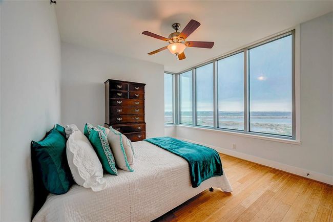 Wake up to stunning ocean views and watch ships sail by from your bedroom. Enjoy the elegance and easy maintenance of beautiful bamboo floors. | Image 10