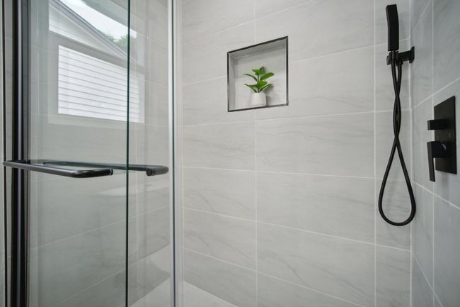 Bathroom featuring a stall shower | Image 17