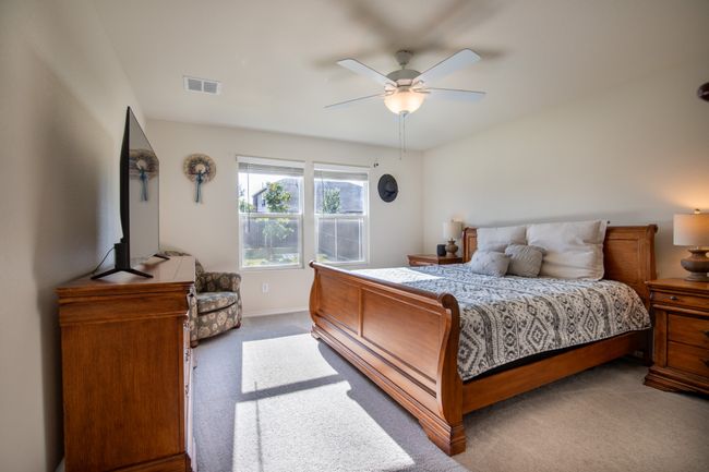 Carpeted bedroom featuring baseboards and ceiling fan | Image 19