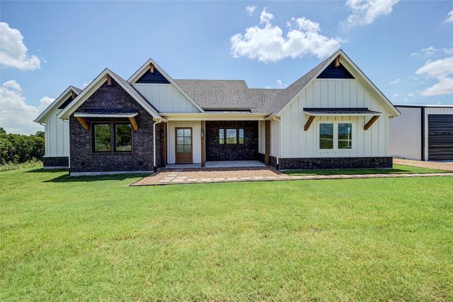 View of front of property with a front yard and a patio area | Image 33