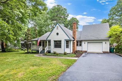 View of front of house with a garage, covered porch, and a front yard | Image 3