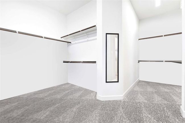 Section of primary bedroom's Oversized Walk in closet ready for any customization | Image 30