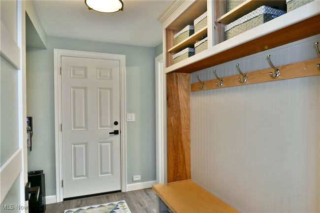 Mudroom with baseboards and wood finished floors | Image 21