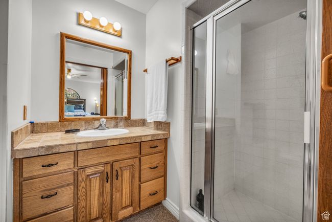 Master Bathroom with vanity, a shower stall, and ceiling fan | Image 15