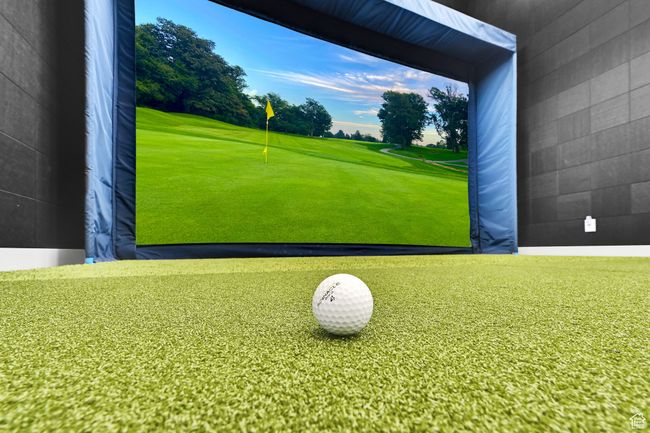 Playroom featuring golf course view and golf simulator | Image 57
