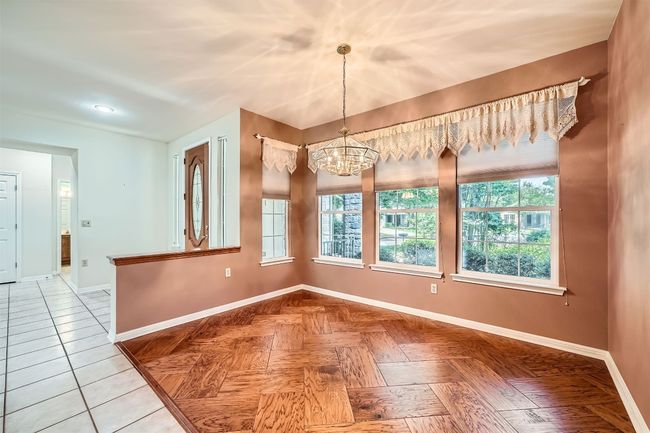 Unfurnished dining area with baseboards, plenty of natural light, and recessed lighting | Image 10