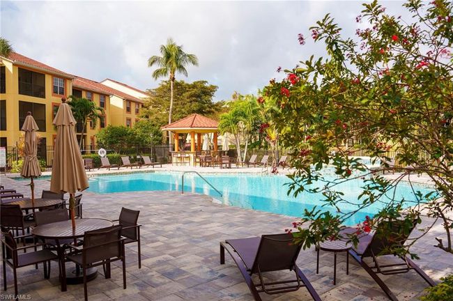 Community pool featuring fence, a gazebo, and a patio | Image 28
