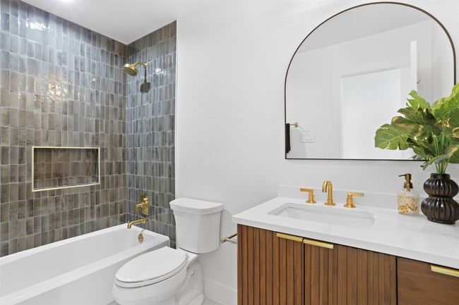 Full hall bathroom with fluted vanity and artisan tile | Image 20