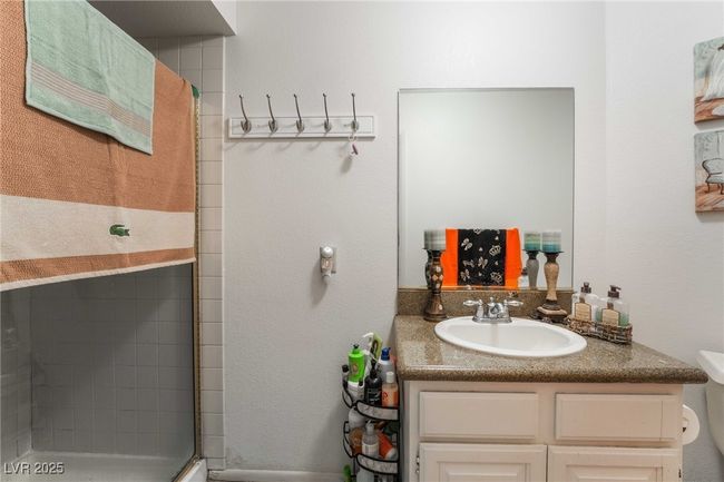 Full bath featuring a shower, toilet, and vanity | Image 35