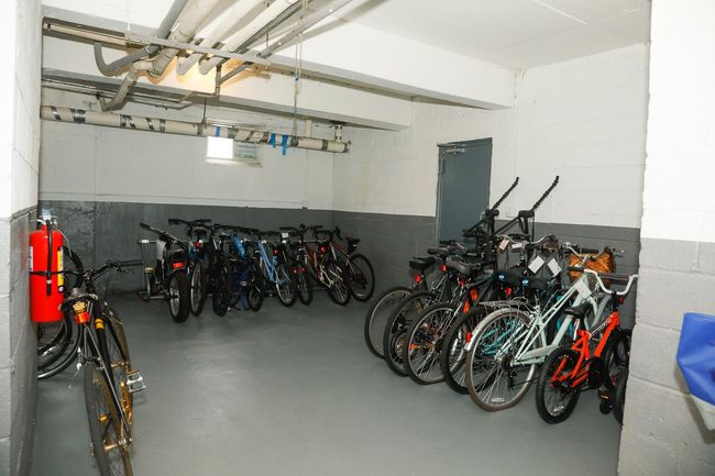 Garage featuring bike storage and concrete block wall | Image 14