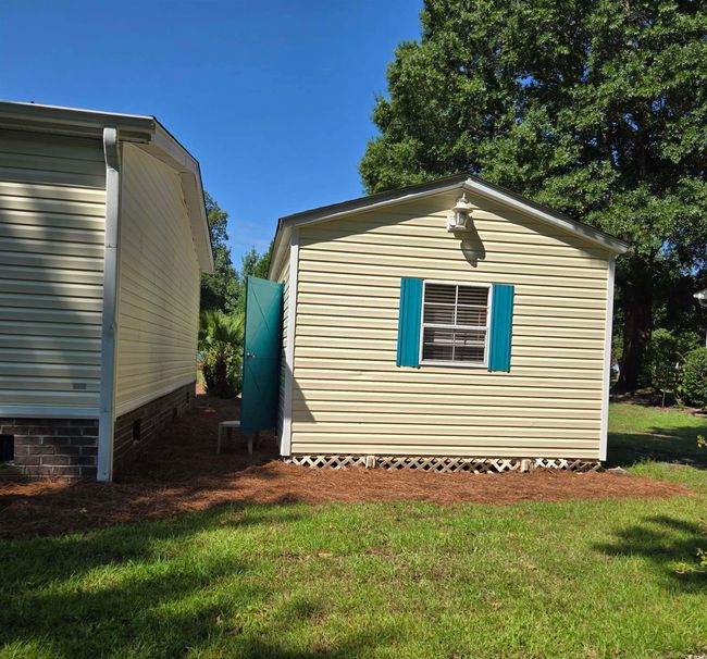 View of property exterior with a lawn and crawl space | Image 37