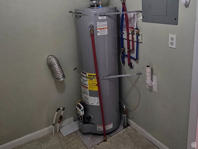 Utilities featuring electric panel and water heater | Image 37