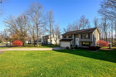 View of front of home with a garage and a front yard | Image 3