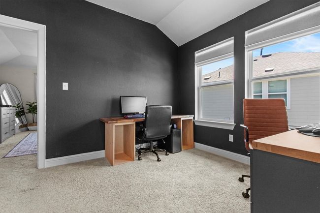 Office space featuring vaulted ceiling and carpet floors | Image 25