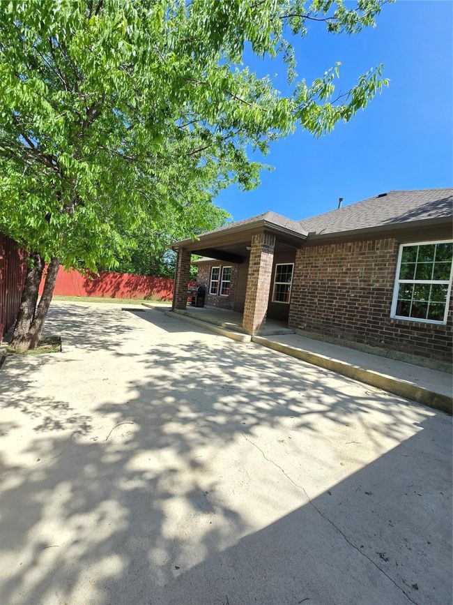 View of patio with fence | Image 16