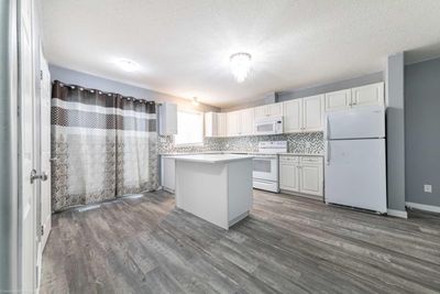 105 - 4701 47 Ave, Home with 4 bedrooms, 2 bathrooms and 2 parking in Lloydminster SK | Image 3