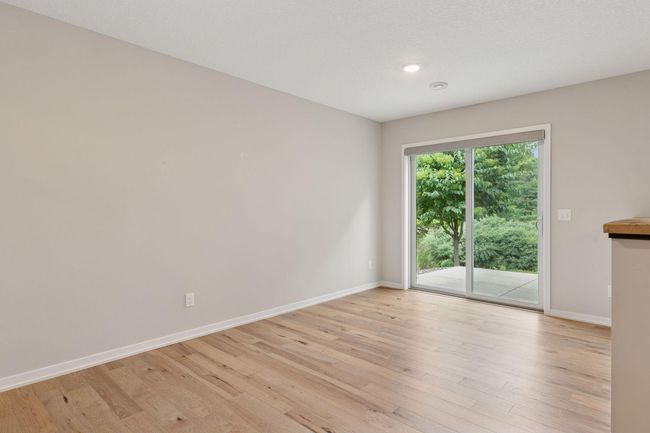 Sliding door off the lower level leads to concrete patio | Image 39
