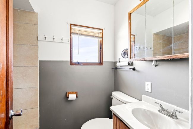 Bathroom featuring toilet and vanity | Image 29