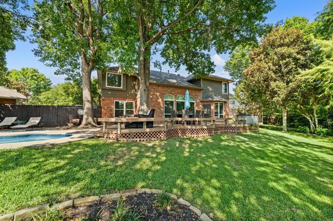 Back of house with brick siding and a deck | Image 35