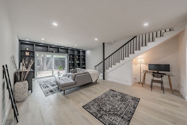 Living area with recessed lighting, stairway, baseboards, and wood finished floors | Image 8