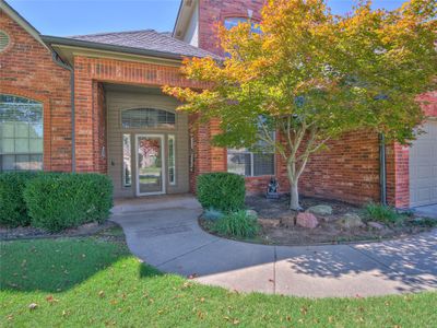 View of exterior entry featuring a garage and covered porch | Image 2