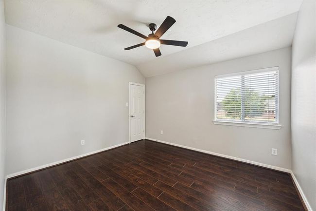 Fourth generously sized bedroom with new fan (2/24), beautiful engineered wood flooring, nice sized closet and window blinds. | Image 45