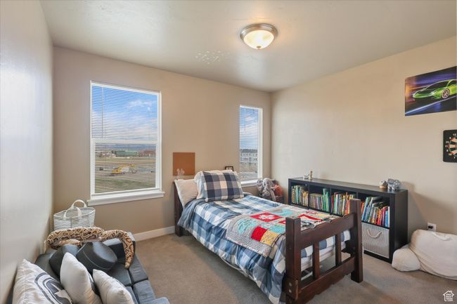 Carpeted bedroom featuring baseboards | Image 7