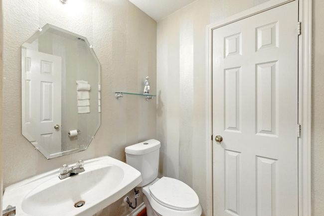 Half bathroom with a sink and toilet | Image 27
