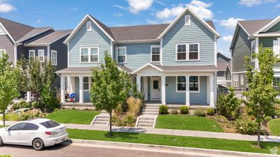 View of front of house with a front lawn and a porch | Image 1