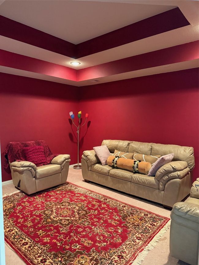 Living room with carpet and a raised ceiling | Image 34